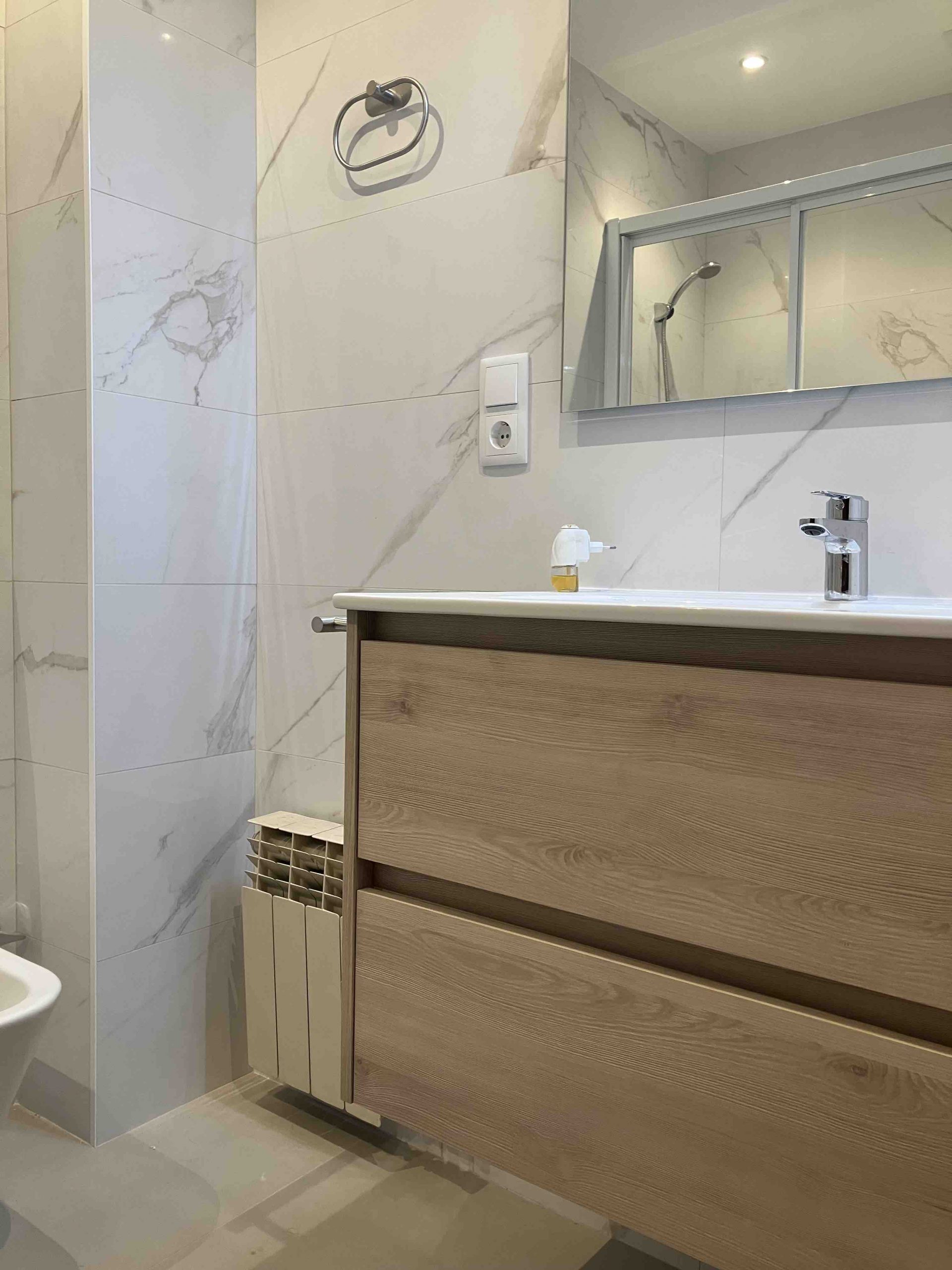 Suspended bathroom cabinet and Tres brand faucets